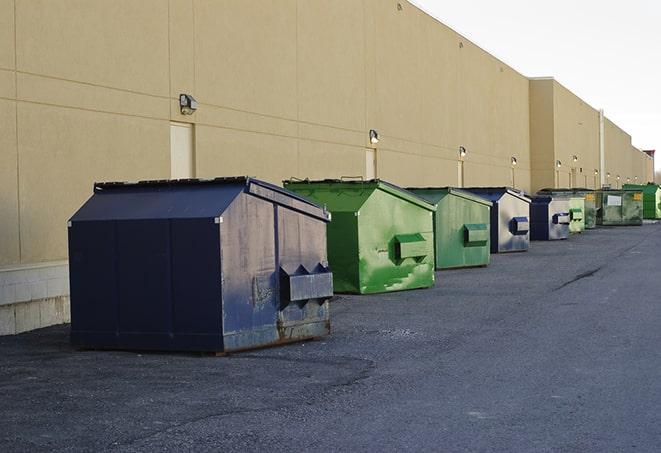 a construction dumpster on a work site filled with debris in Dunwoody, GA